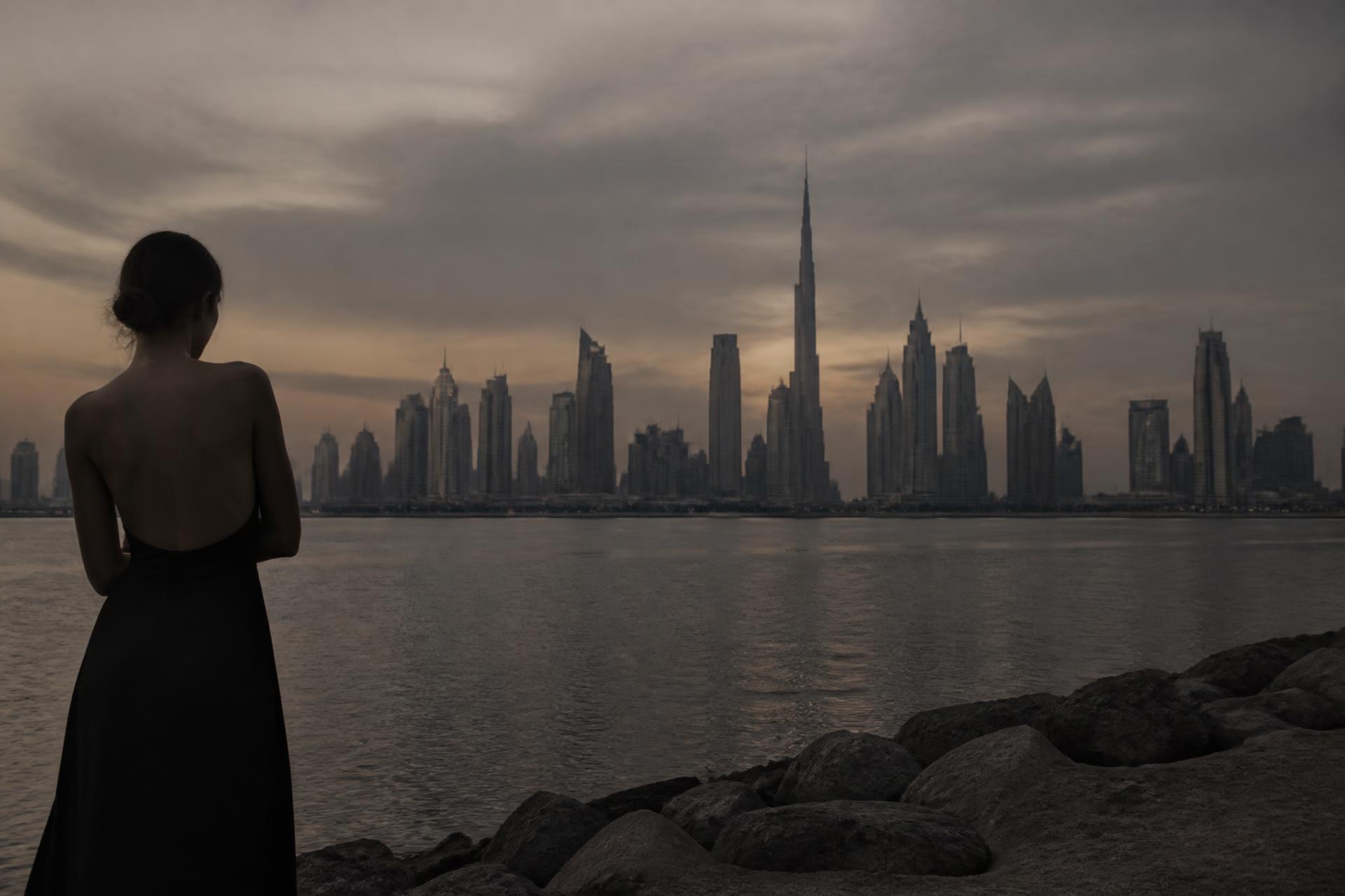 Dusk over a luxury skyline across still water